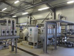 Pump and auxiliary piping skids in the plant hall